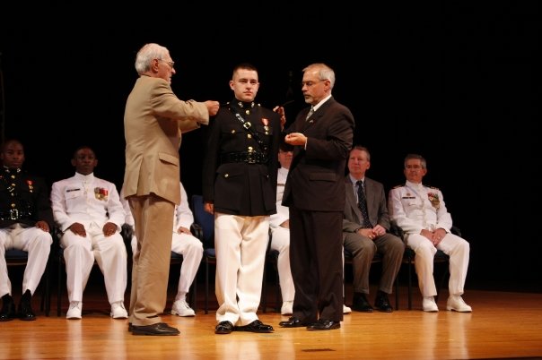 My dad and my granddad pinning my brother during his commissioning.